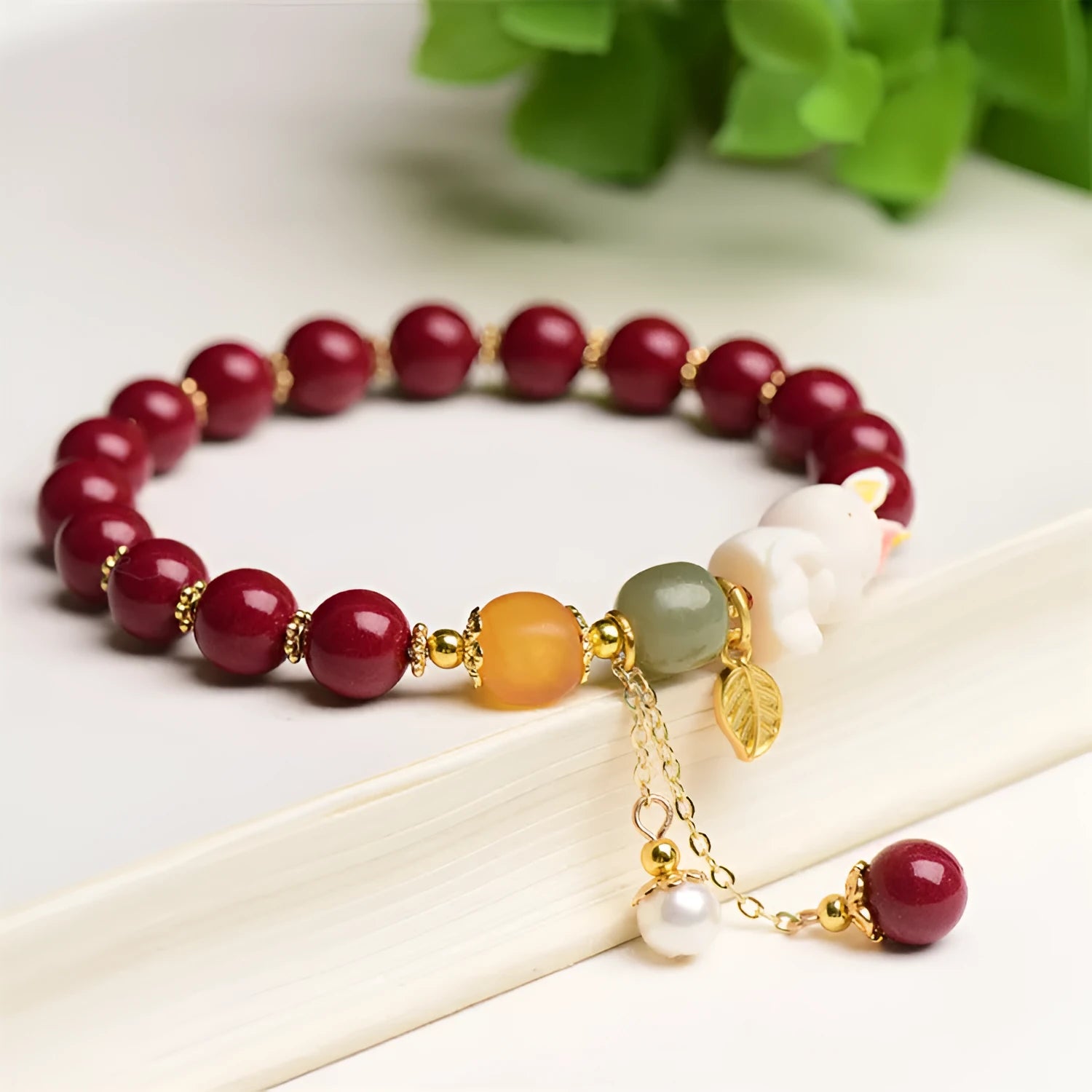 Natural cinnabar rabbit bracelet for women in national style, shown in 8mm and 10mm size options.