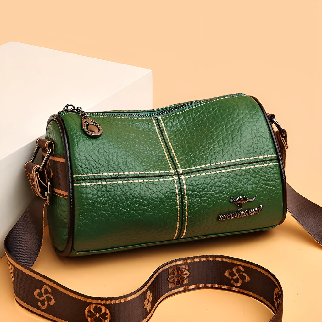 Women's casual stitched genuine leather shoulder bag in cylindrical shape, available in black, brown, green, and white