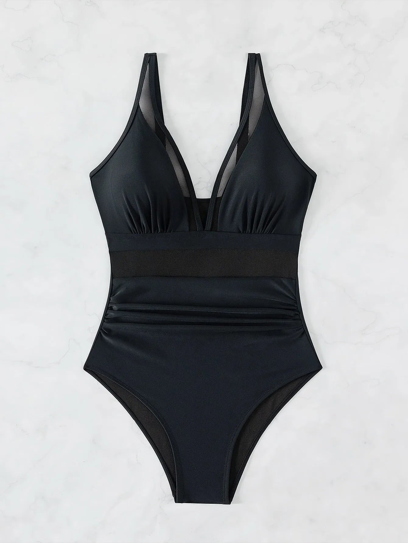 Black women's halter neck one-piece swimsuit with mesh detail and high-cut briefs.