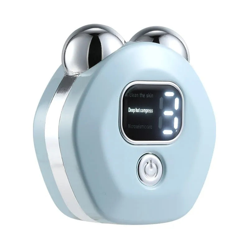 Portable white hot compress micro current facial massage instrument with double-roller head on a table.