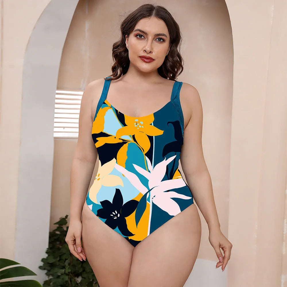 Floral print one-piece swimsuit with spaghetti straps and a conservative vest-style top.