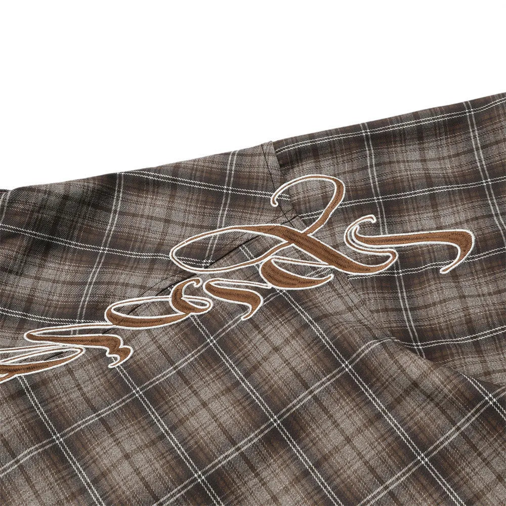 Men's black and brown plaid short sleeve shirt with embroidered letter and lapel collar.