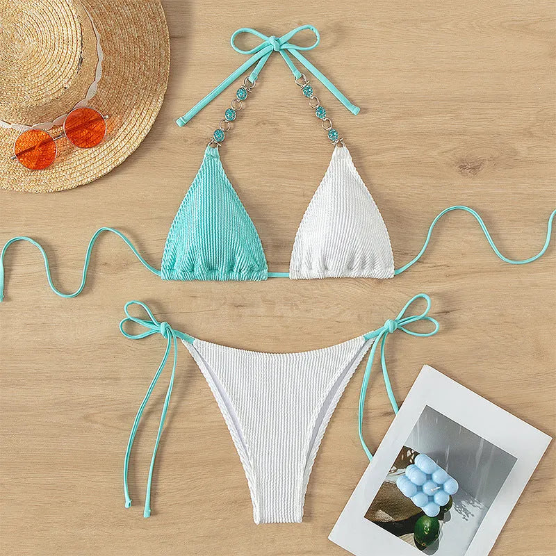 Women's colour matching swimsuit with lace-up front and pearl chain detailing on two-piece bikini