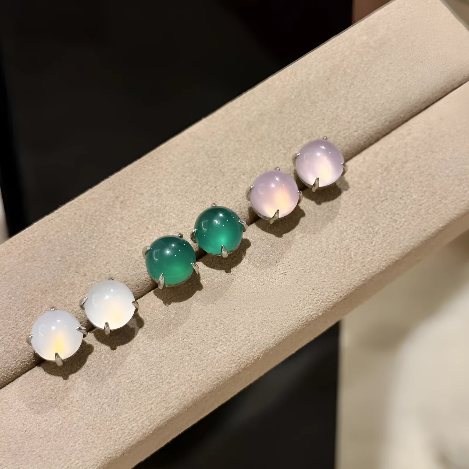 Chinese style chalcedony stud earrings with geometric design and claw setting