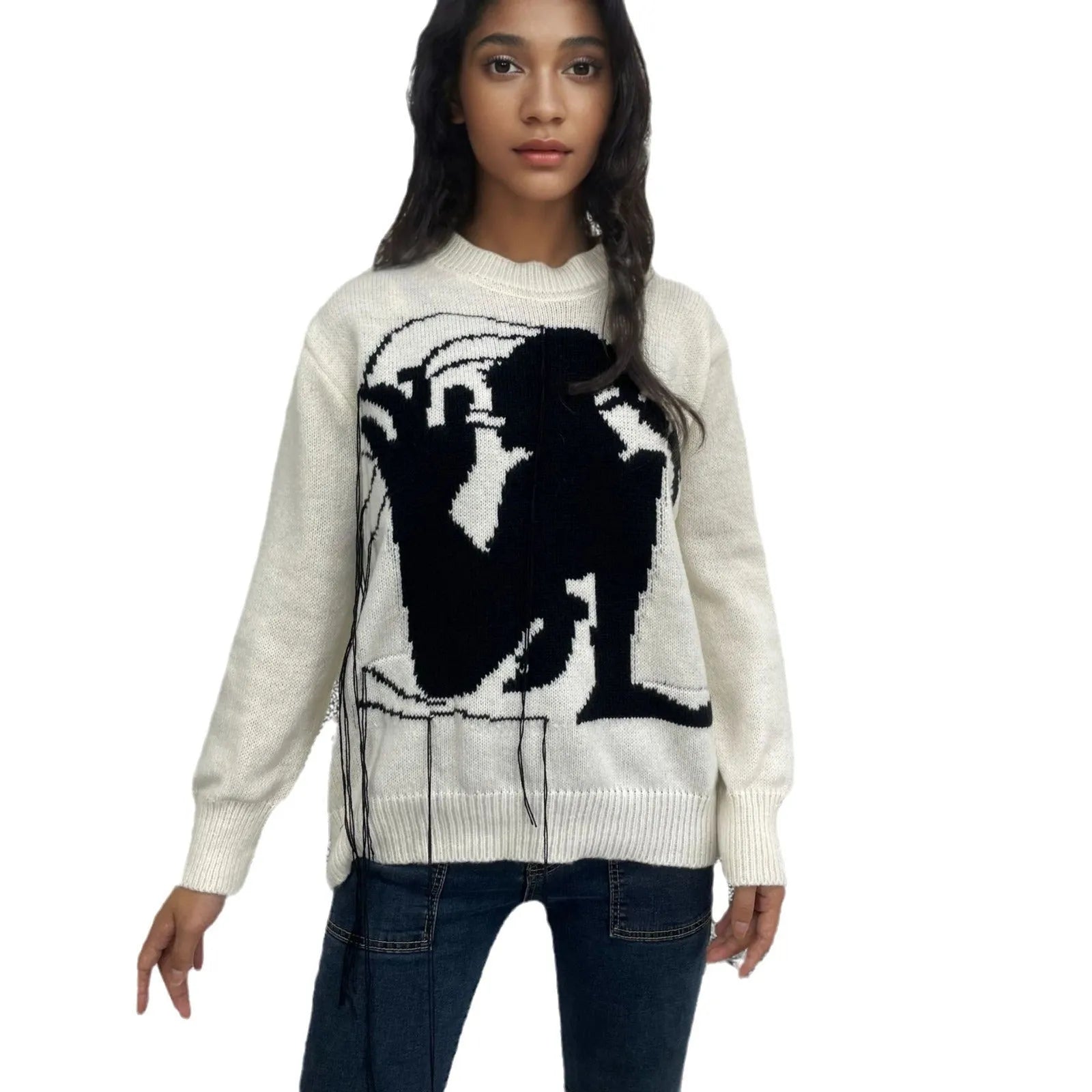 Women's grey alpaca wool sweater with tassel detailing and round neck.