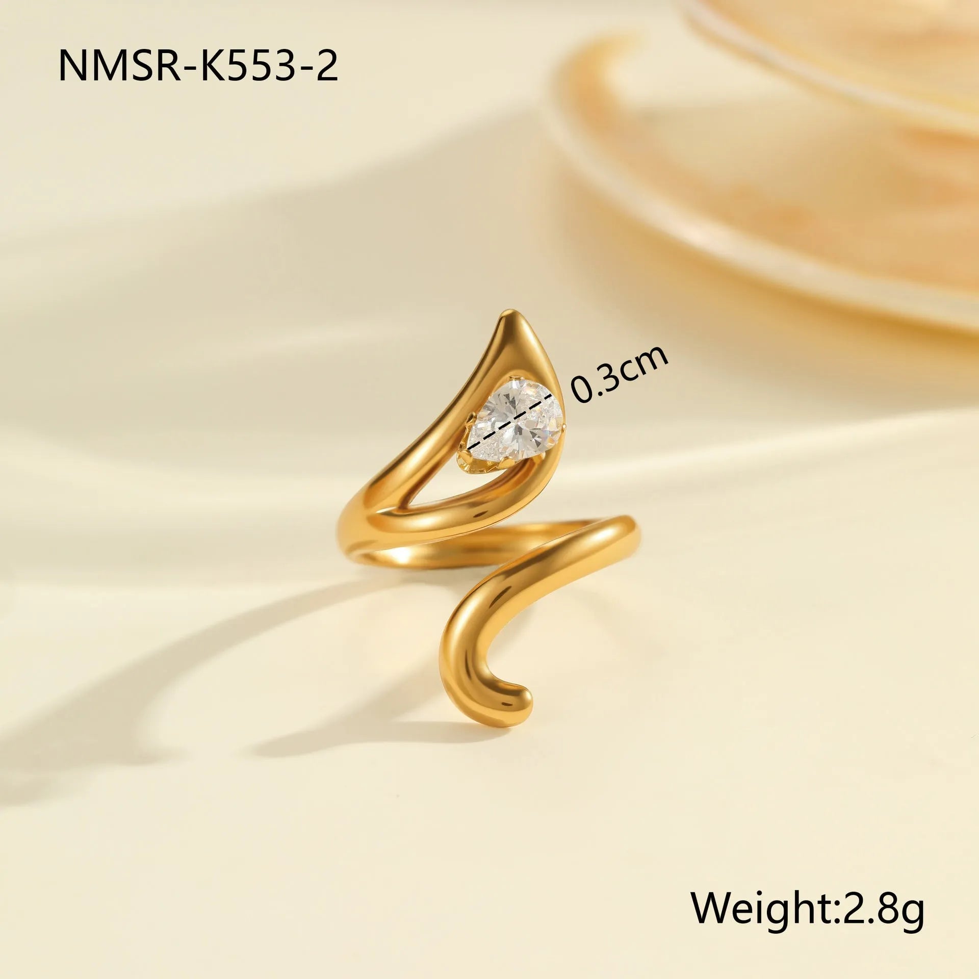 Adjustable geometric stainless steel ring showing open mouth design and colour variations