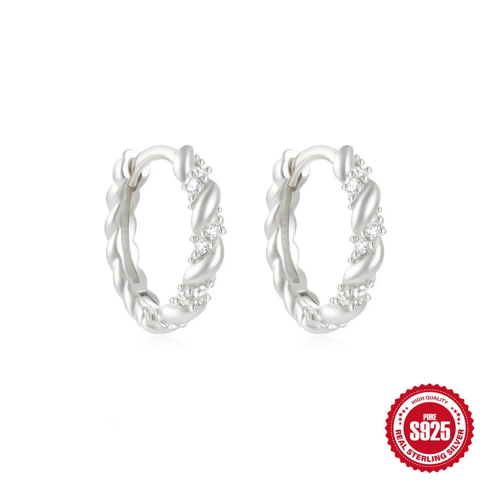 Sterling silver geometric stud earrings with round diamond accents in gold and silver electroplated finishes