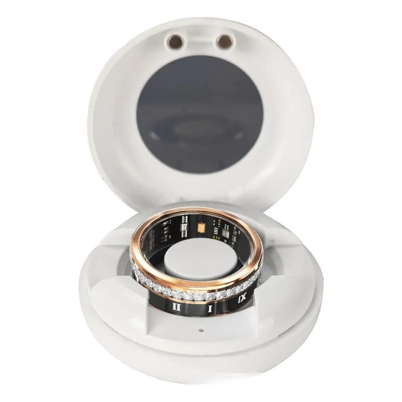 Silver and gold smart rings with blood oxygen monitoring feature on display with charging cable