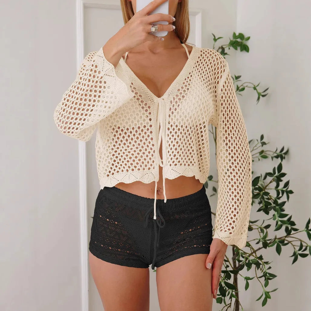 Women's hollow woven cardigan blouse with bell sleeves in short length available in four solid colours