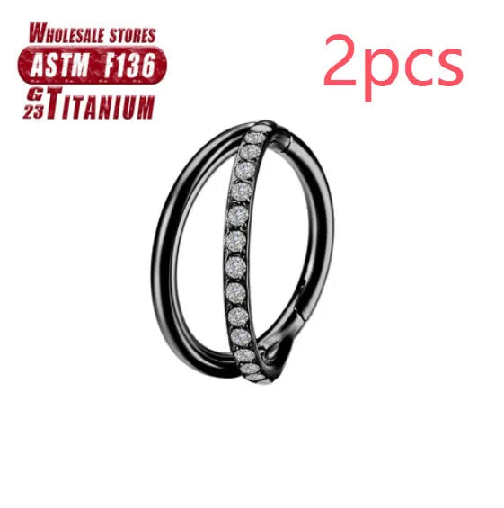 Close-up of a titanium alloy nose ring with a fork closure, shown in silver finish on a grey background.