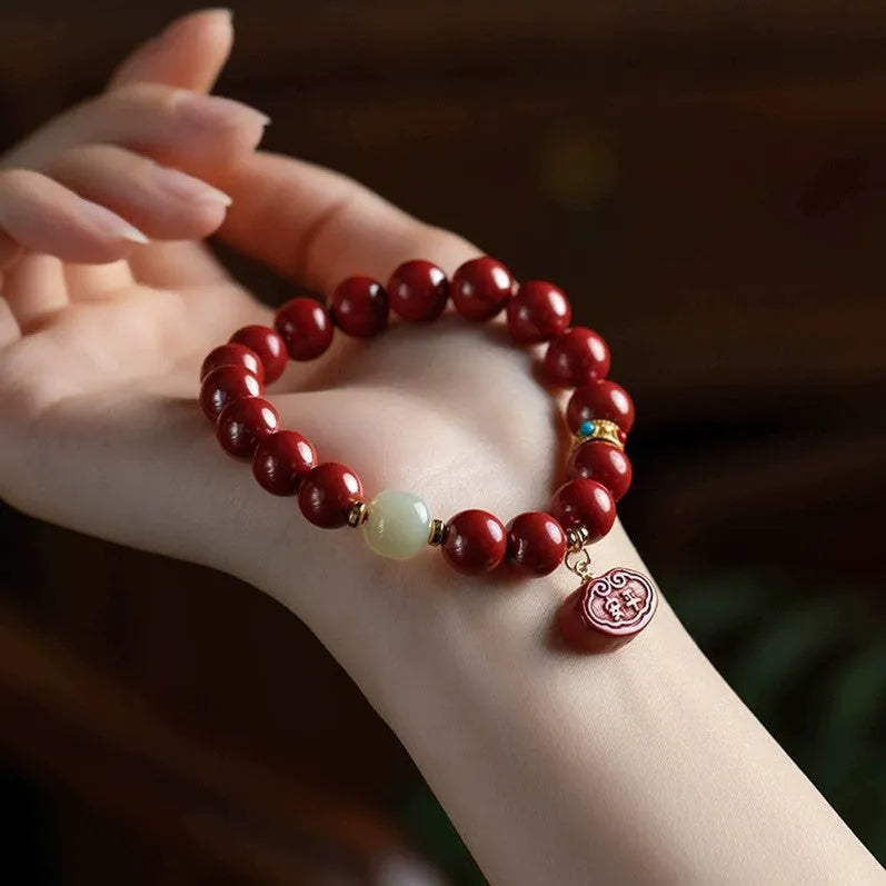 Natural cinnabar bracelet with Ping An Fu Lu design on 8mm or 10mm beads.