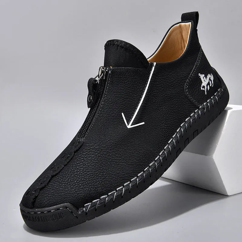 Men's black leather-look casual boot with front zipper, round toe, and mid-calf shaft.