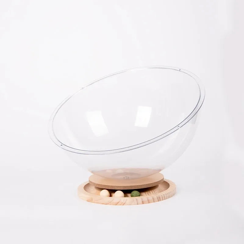 Transparent acrylic space capsule-shaped cat bed or enclosure on a turntable base.