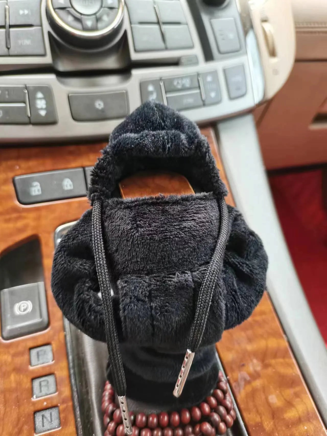 Dutch velvet car gear handle sleeve cover shown in various colours including black, red, blue, and pink.