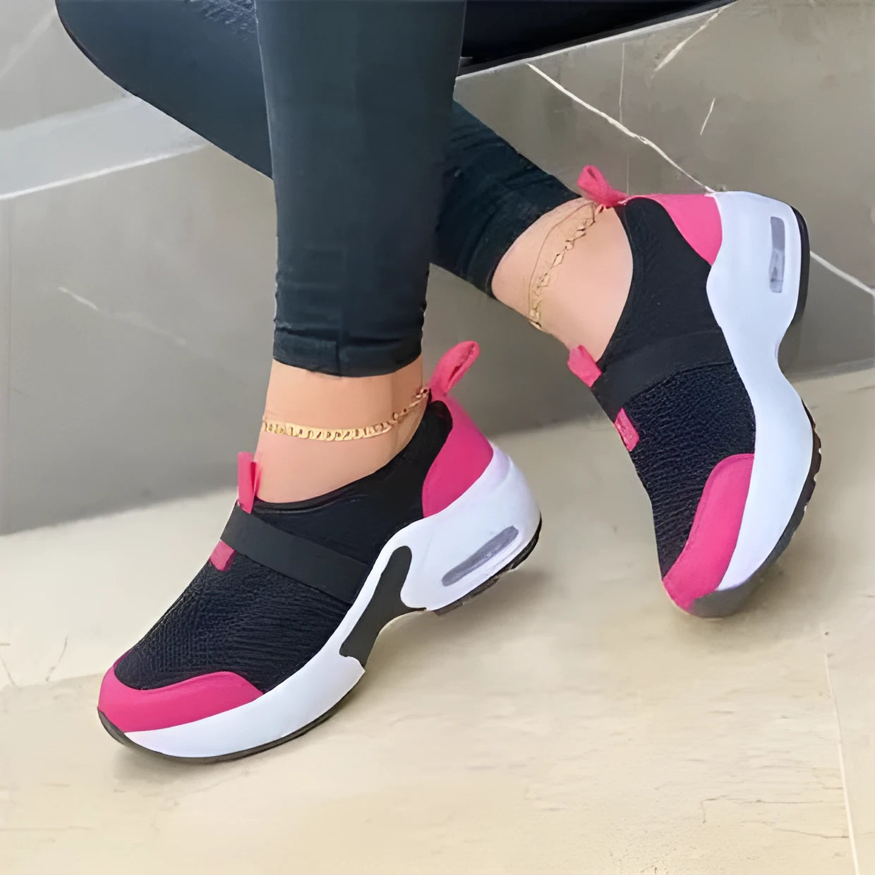 Women's white mesh flat sneakers with round toe and colour stitching on a rubber sole.