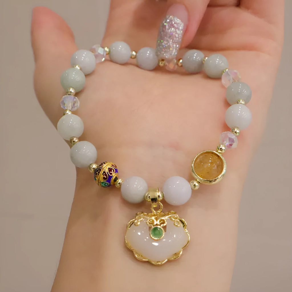 Women's bracelet with strawberry quartz and gray jade stones and ethnic metal decorations