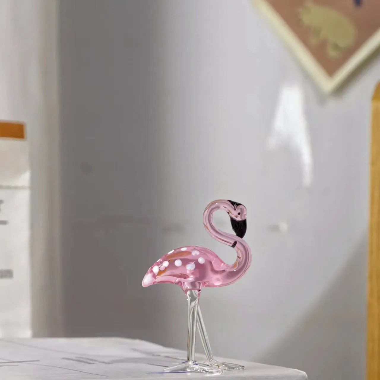 Pink crystal flamingo decorative figurine on table with modern simple style