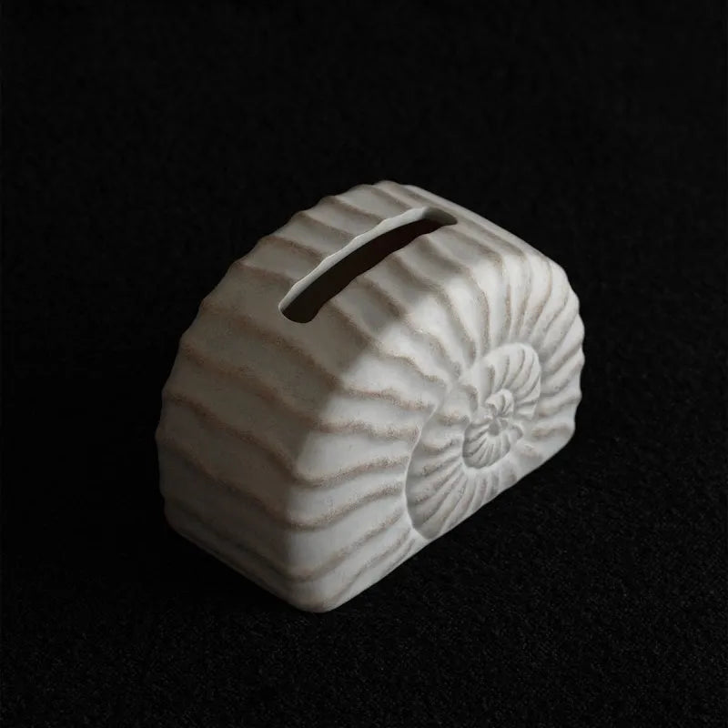 Resin conch shell tissue box decoration in conch ramble colour on wooden table