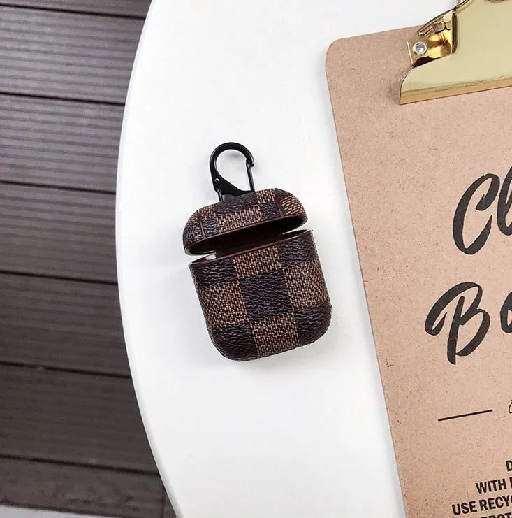iPhone XS Max hard shell plastic case with grid pattern and integrated hook for Apple AirPods 2nd gen case.