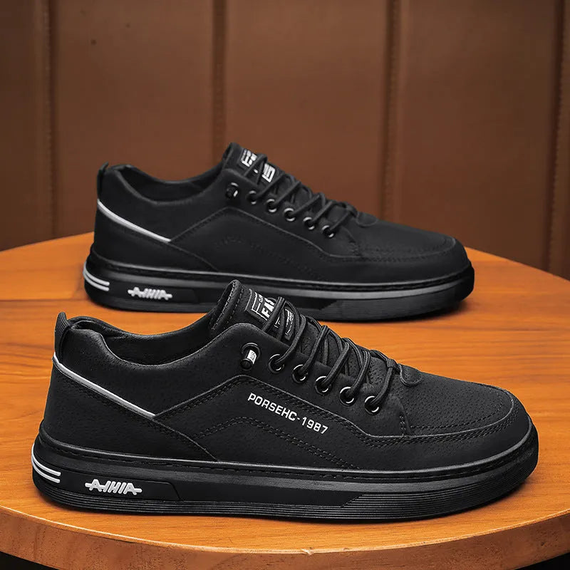 Men's black low-top casual work shoes with a rubber sole and artificial PU upper.