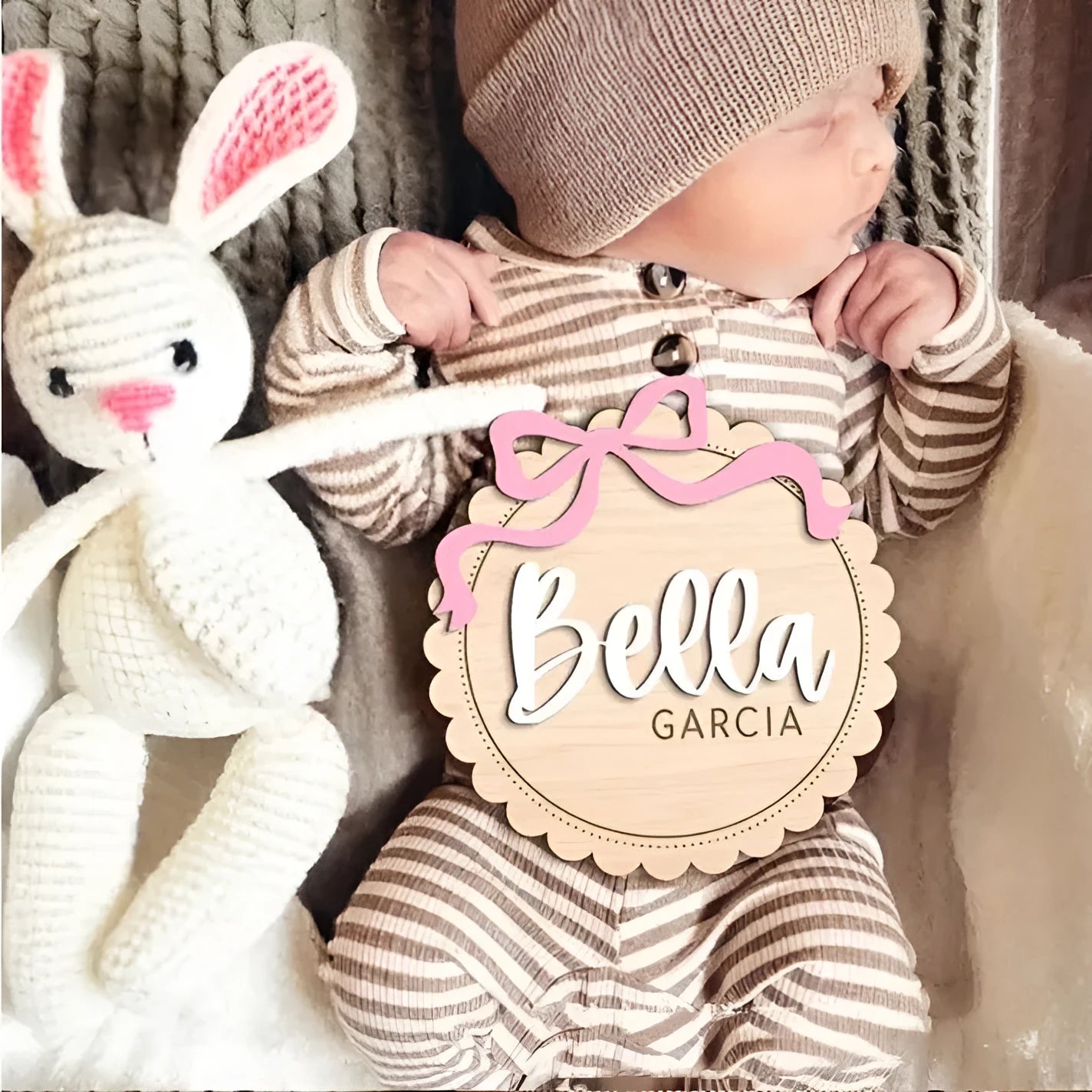 Customised square wooden baby room ornament with a personal name, shown in two size options.