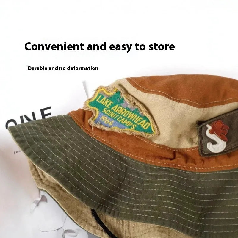 Army green cotton foldable fisherman hat with flat top crown and hand-painted punk details