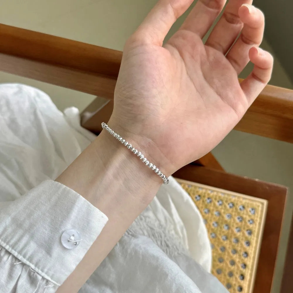 S925 sterling silver bracelet for women with crescent and round beads in geometric design, platinum finish, on white background