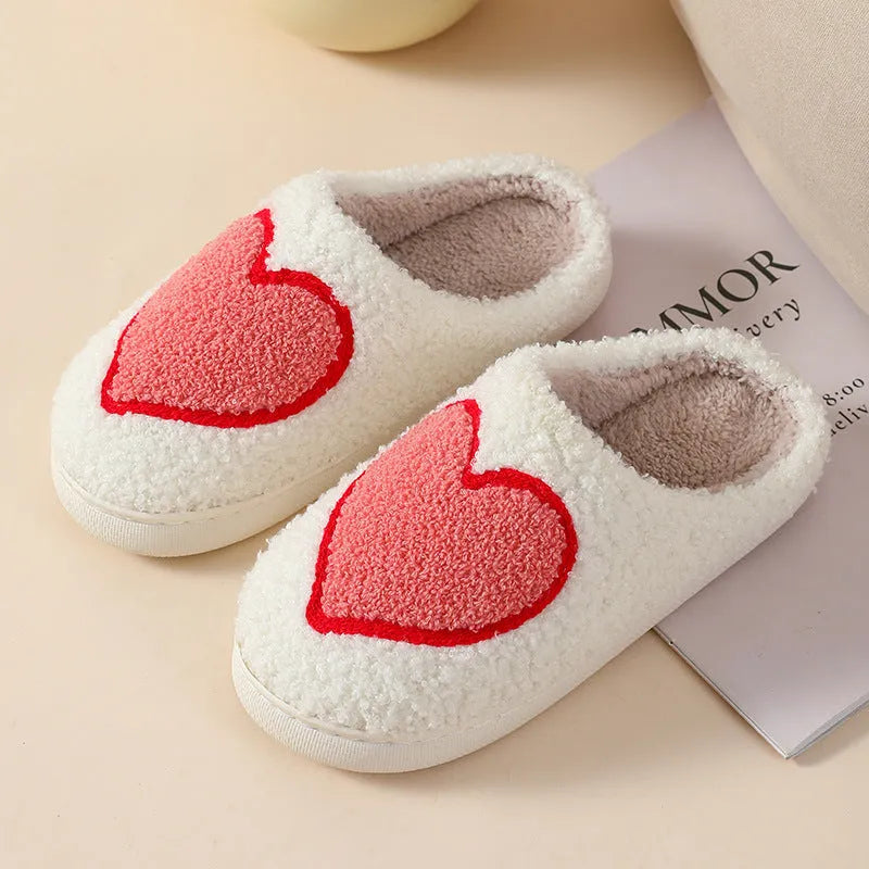 Women's plush slippers with cartoon love patterns and PVC non-slip soles in multiple colour options