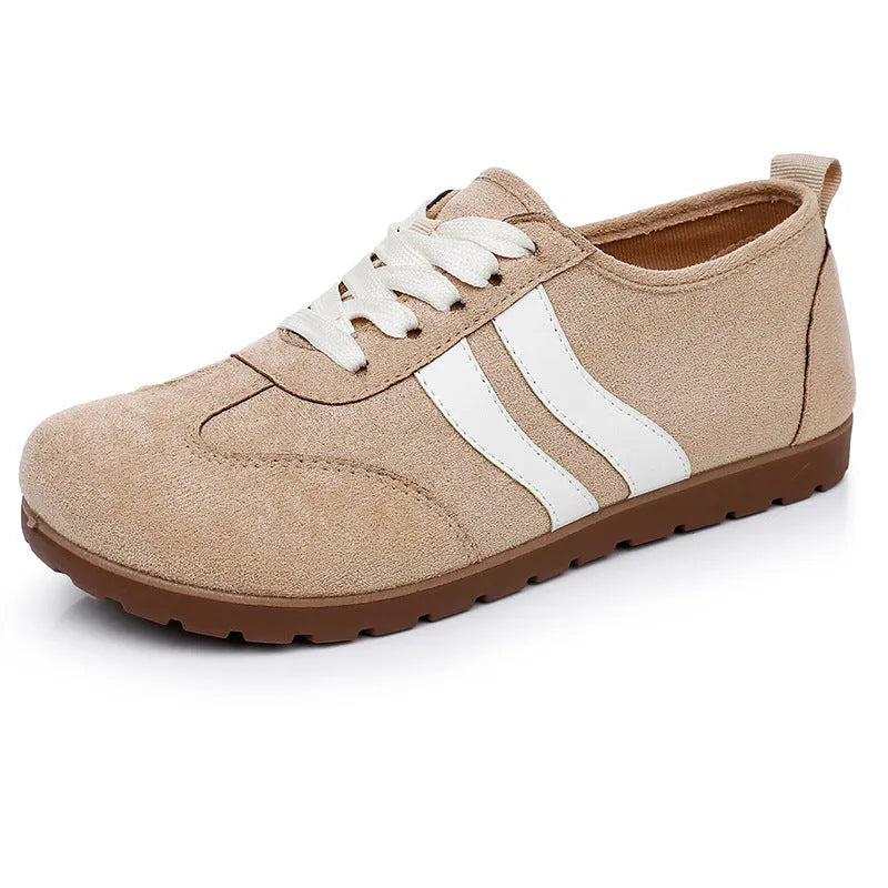Women's vintage canvas sneakers in dark red with a soft rubber sole and round toe.