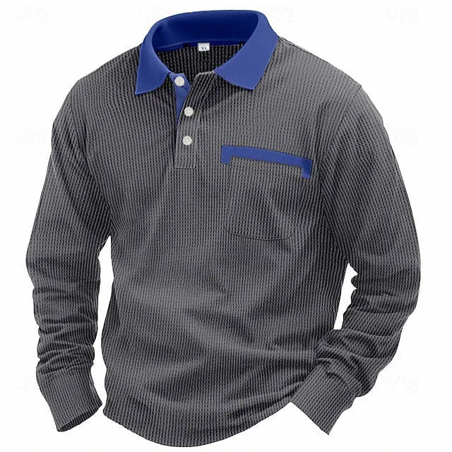 Man wearing a long-sleeved waffle-texture polo shirt in a solid colour with an asymmetric design detail.