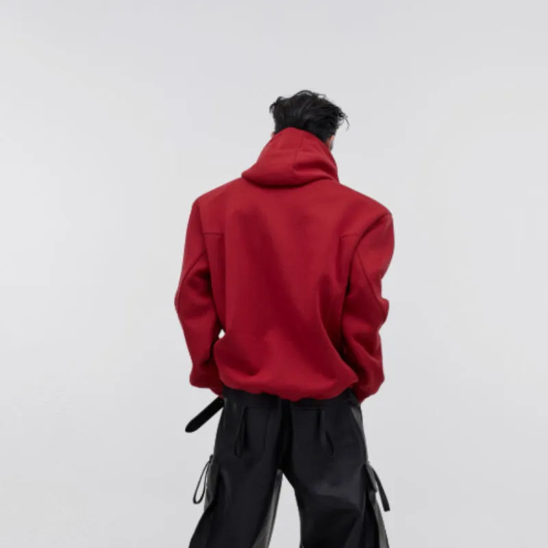 Men's red loose fit hooded sweater with heavy shoulder pads and metallic 3D printing detail.