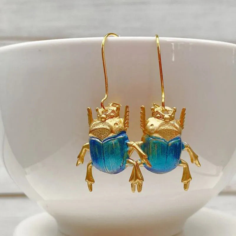 Retro beetle earrings for women, gold metal with electroplated blue finish, creative insect design