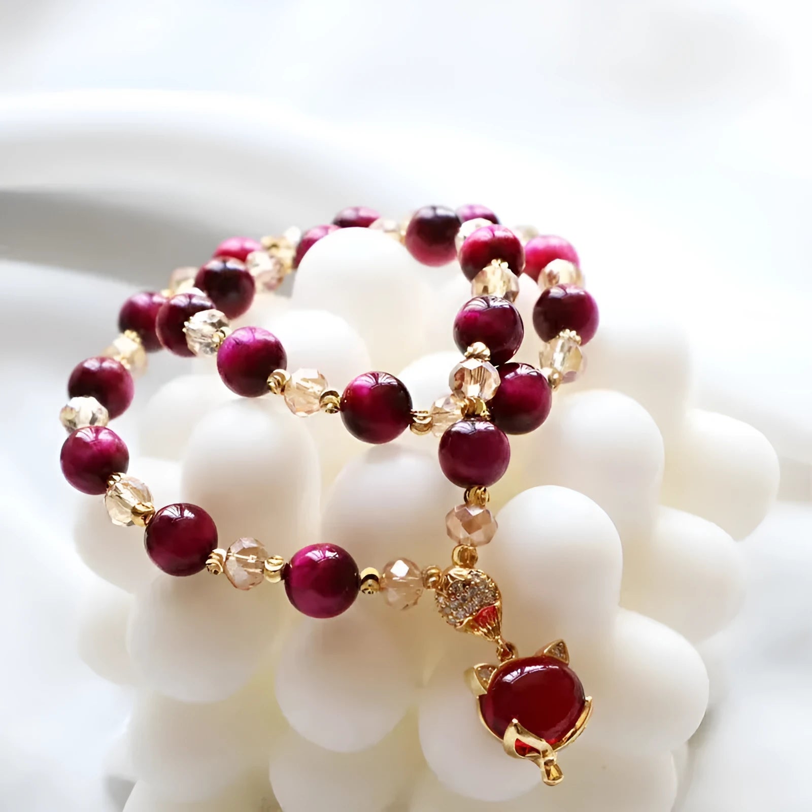 Handmade Vanves Stone Tigereye bracelet on wrist, showing single and double chain options with fox and leather charms.