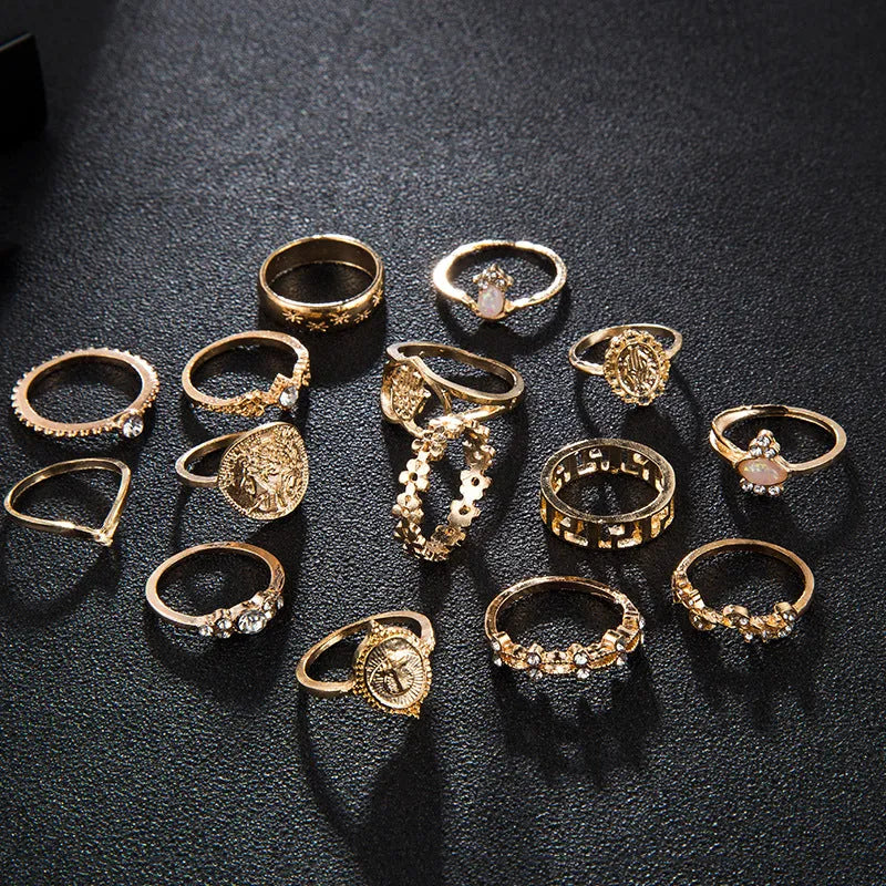 12-piece cross ring set in gold alloy on a flat surface, showing one size design