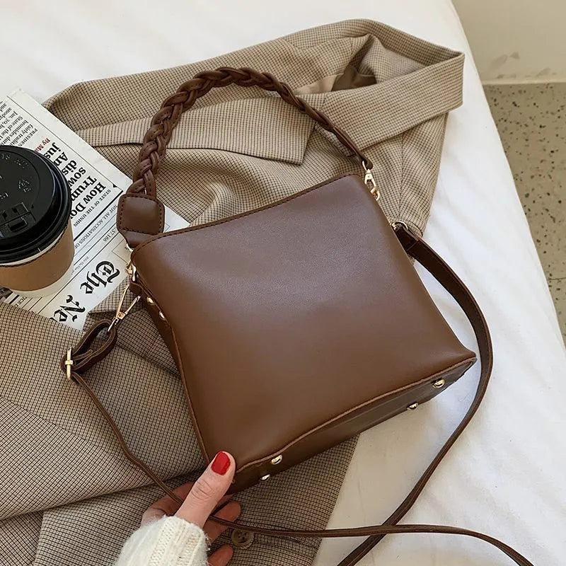 Woven PU one-shoulder crossbody bucket bag in retro style, shown in khaki colour.
