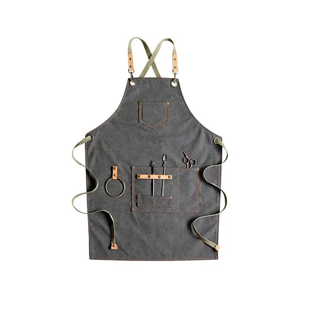 Canvas apron with cross-back straps in camel colour for cafe or baking work