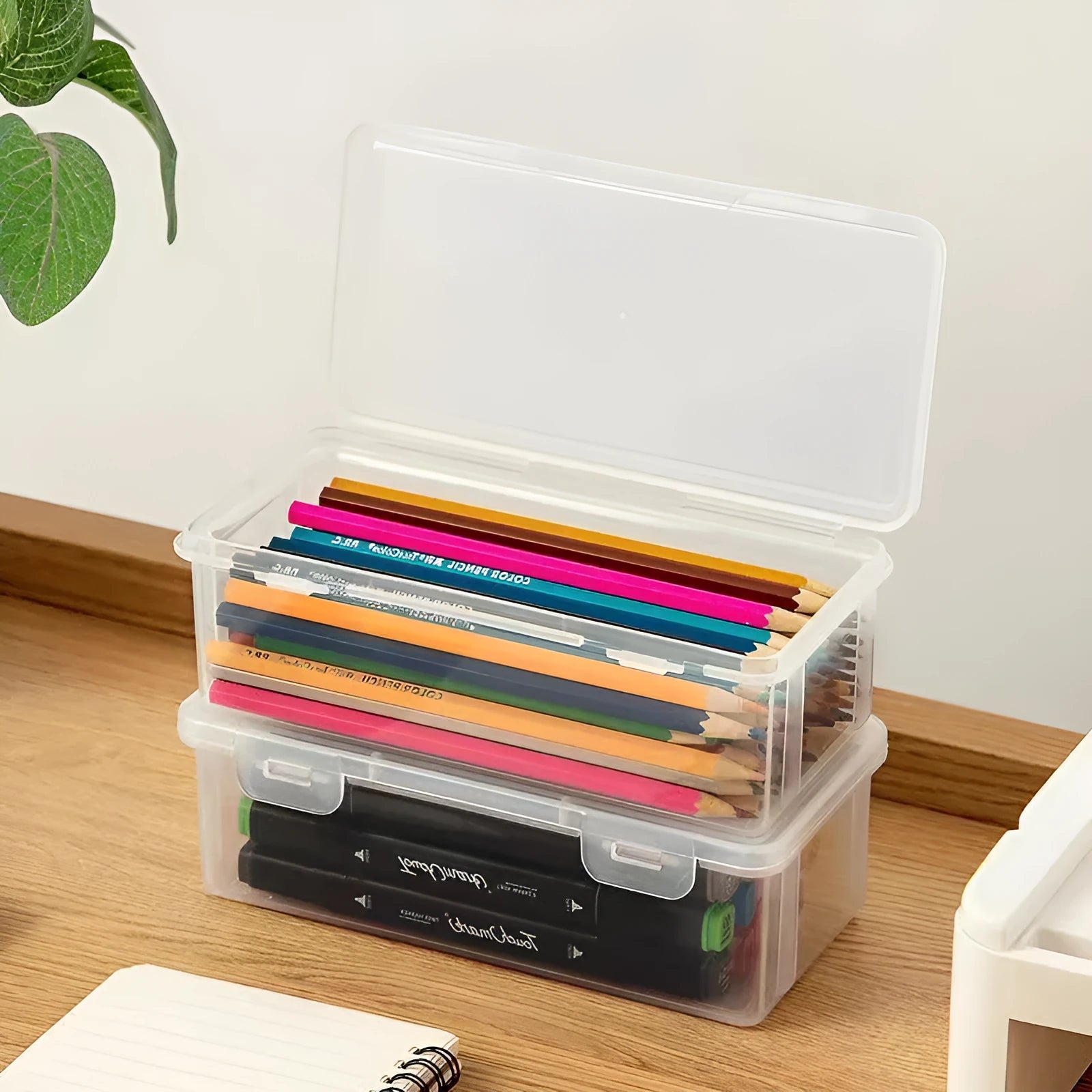 Transparent PP plastic stationery storage box with pencils and art supplies visible inside