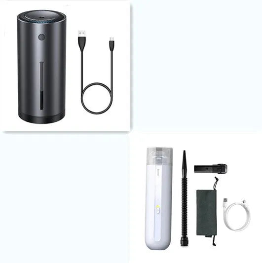 Black cordless handheld car vacuum cleaner with blowing hose attachment on a desktop.