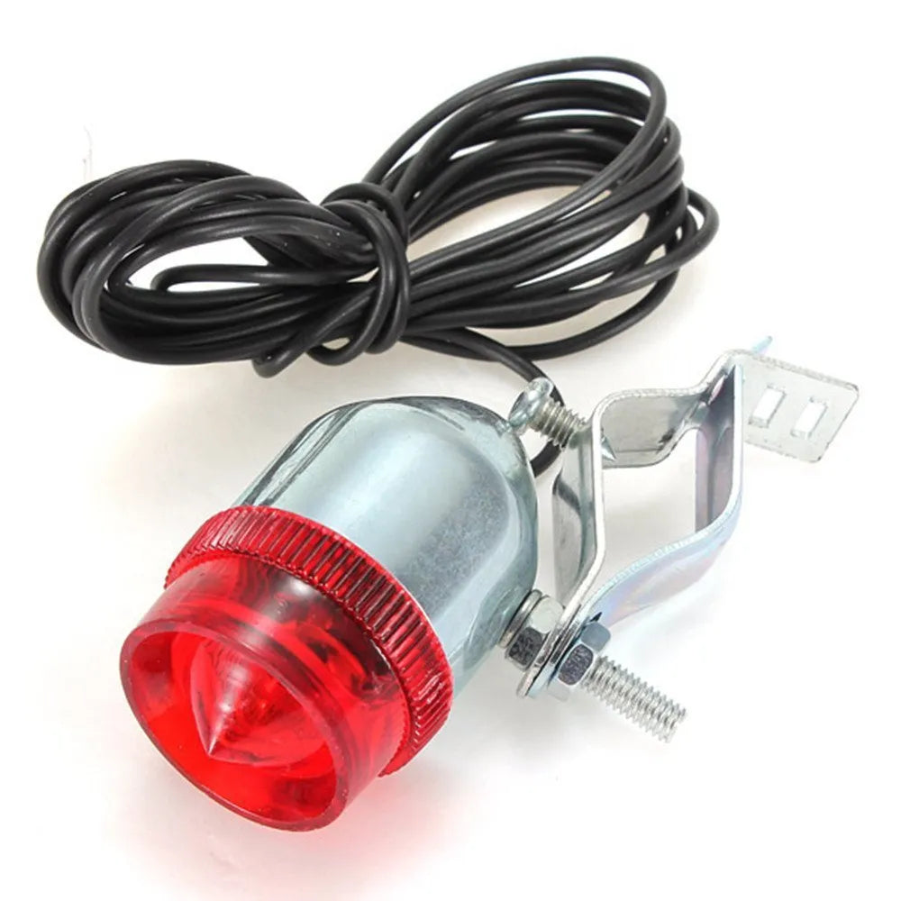 Silver bicycle dynamo generator light kit mounted on a bike frame with front and rear lights