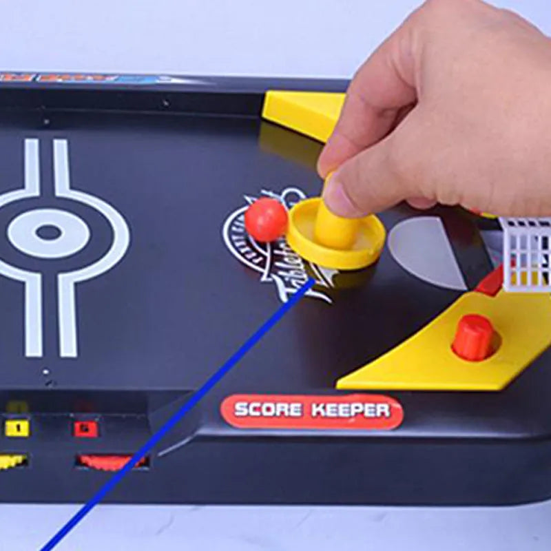 Desktop hockey table with goals, sticks, and balls for children's air hockey game