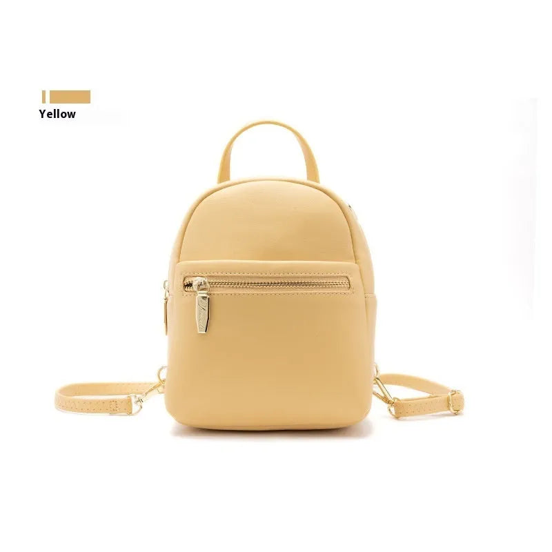 Soft PU mini backpack in street trend style with three-dimensional outer pocket, shown in one of six colour options.