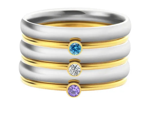 Close-up of a geometric titanium steel ring with December birthstone and engraved pattern, shown in one of three colour options.