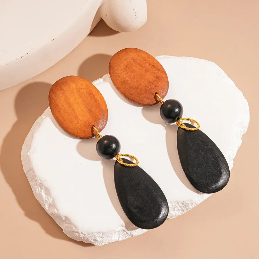 Wooden handmade retro fashion earrings with ellipse shape and brown-black colour combination