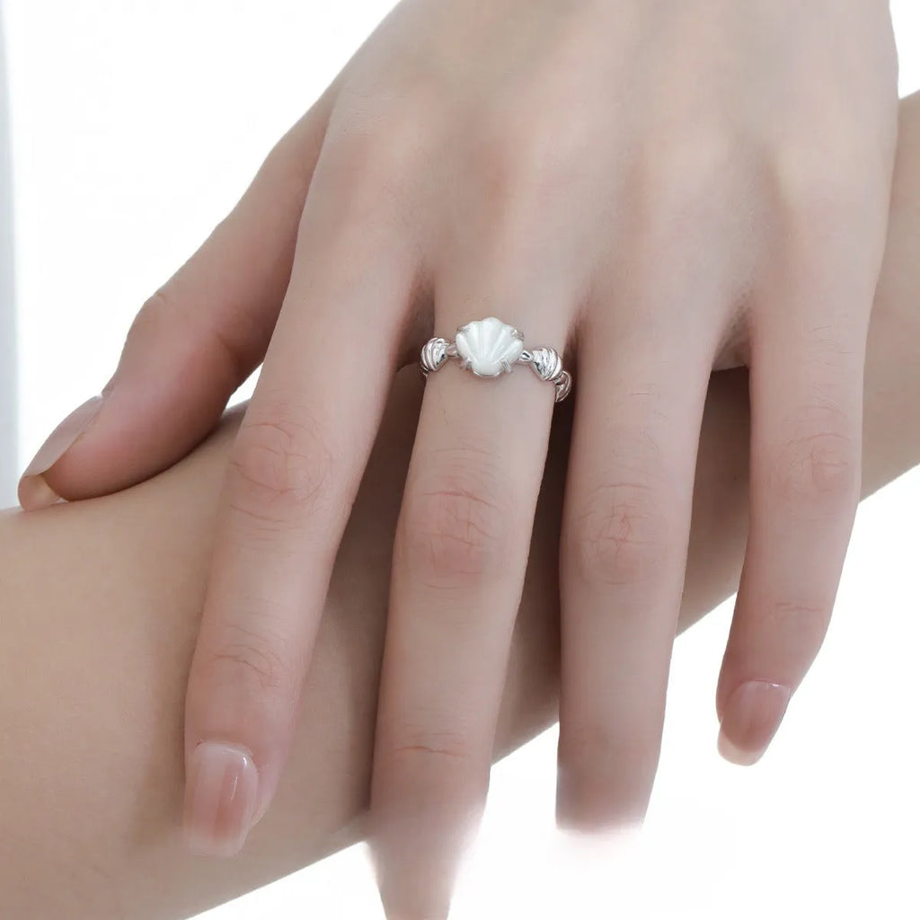 Adjustable sterling silver ring with shell elements and electroplated gold finish