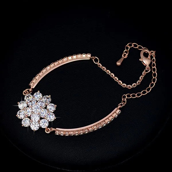 Rose gold cubic zirconia bracelet with cross crown Roman numeral motifs on alloy setting
