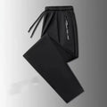 Men's loose fit thin ice silk polyester trousers in black leg style for autumn casual wear