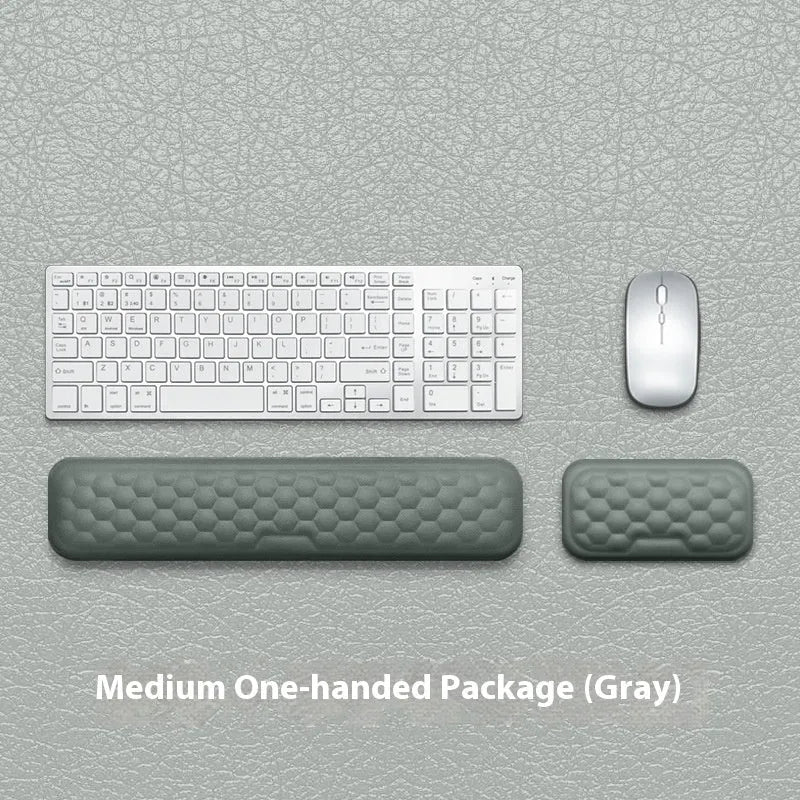 Memory foam mouse wrist rest with silicone base in black cloth and grey leather style options.