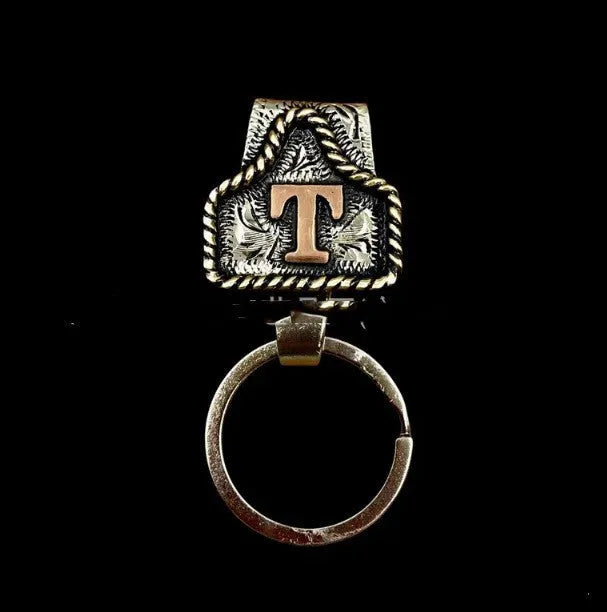 Handmade metal cow tag belt keychain in a selected colour from the A-Z letter range.