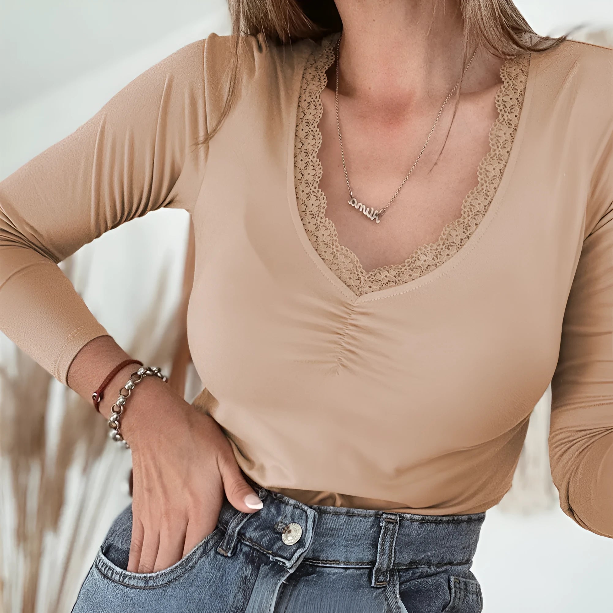Women's red slim fit long sleeve casual pullover top on a hanger.
