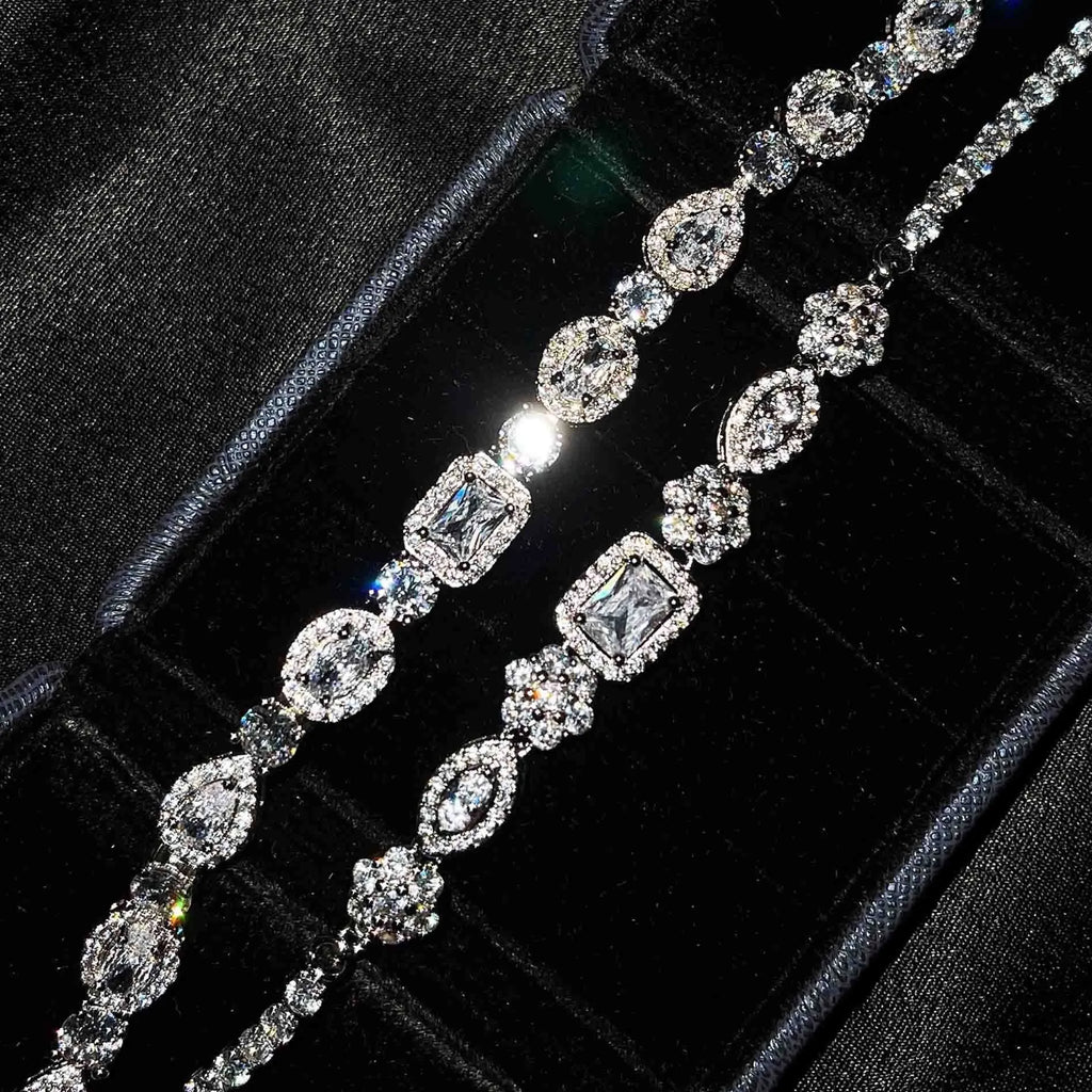 Women's sterling silver-plated bracelet with white gold finish and inlaid zircon stones.